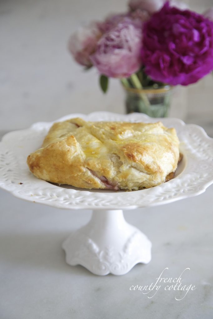 Baked brie in pastry on pedestal