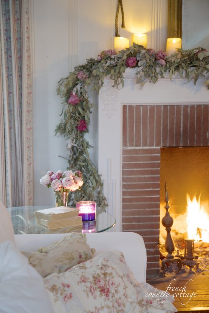 Winter garland on mantel with flowers and eucalyptus