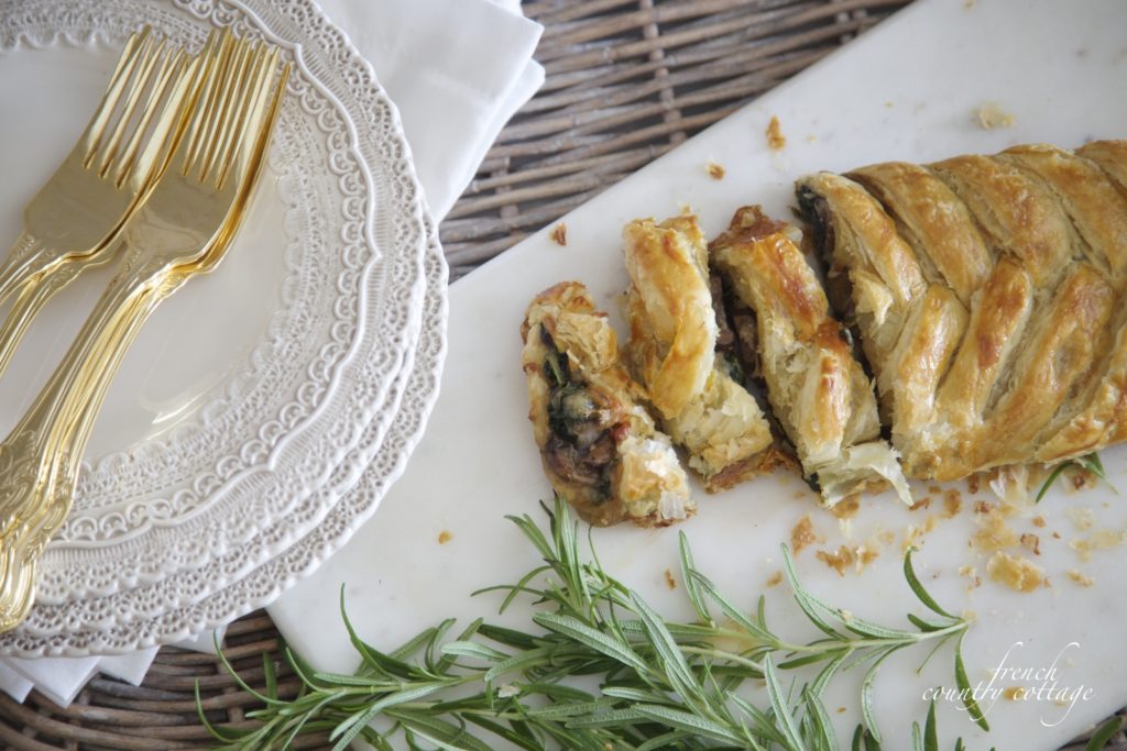Spinach mushroom pastry with dishes in basket