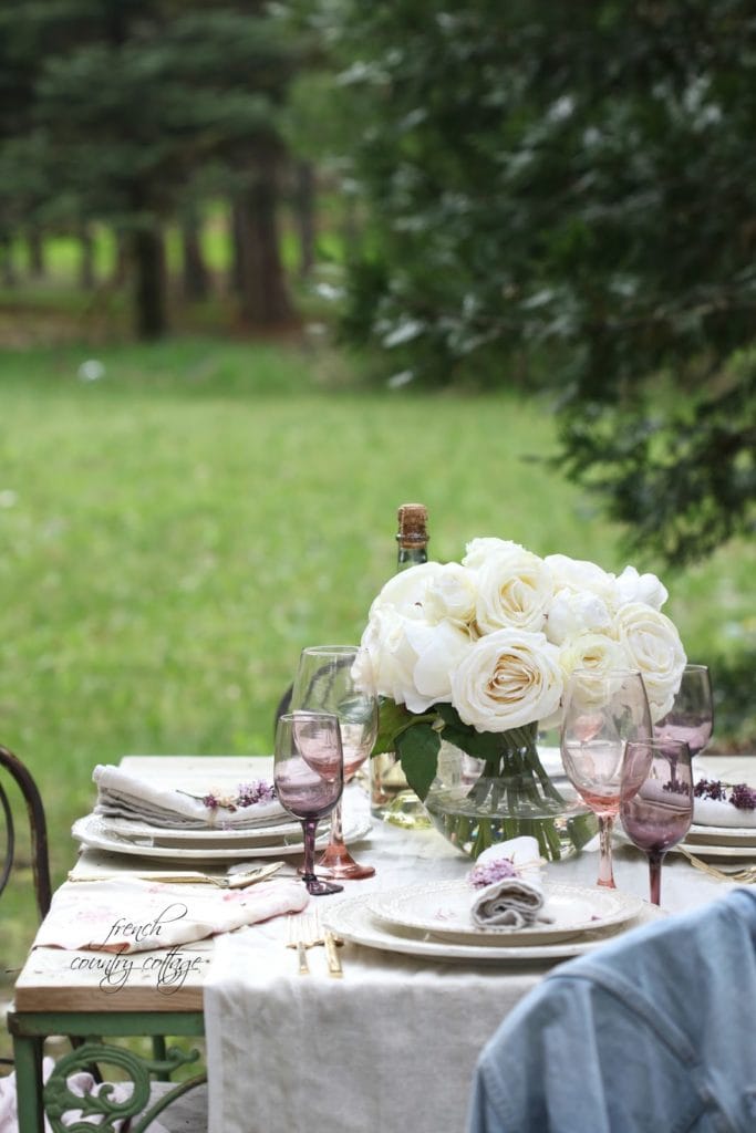 vintage table with pastel stemware and flowers