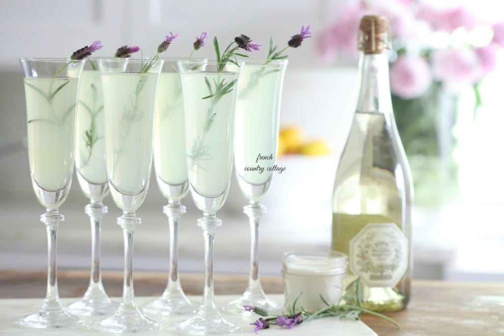 Lavender Lemonade in champagne flutes with fresh lavender for garnish