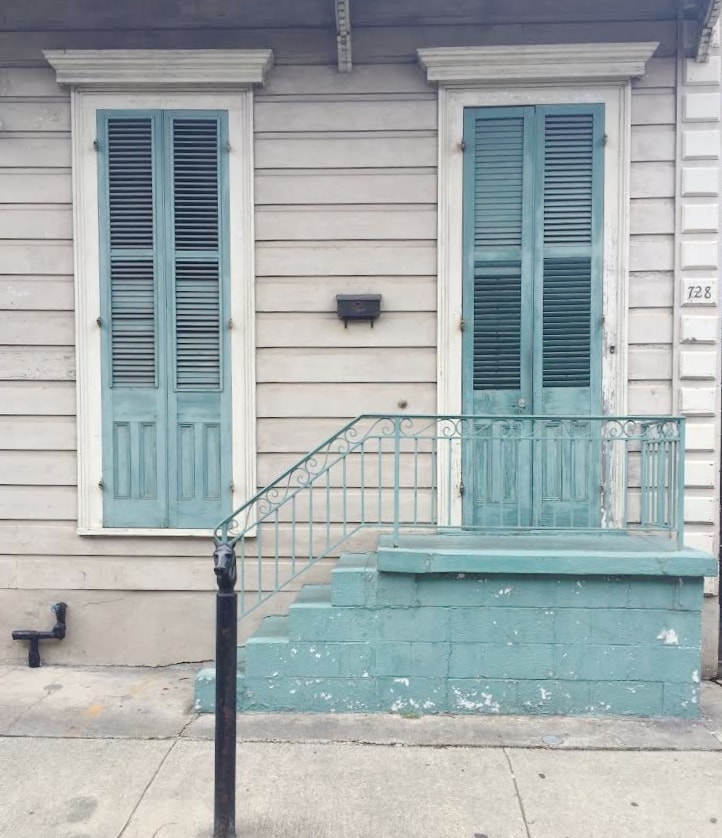 Blue shutters on old building in New Orleans French Quarter