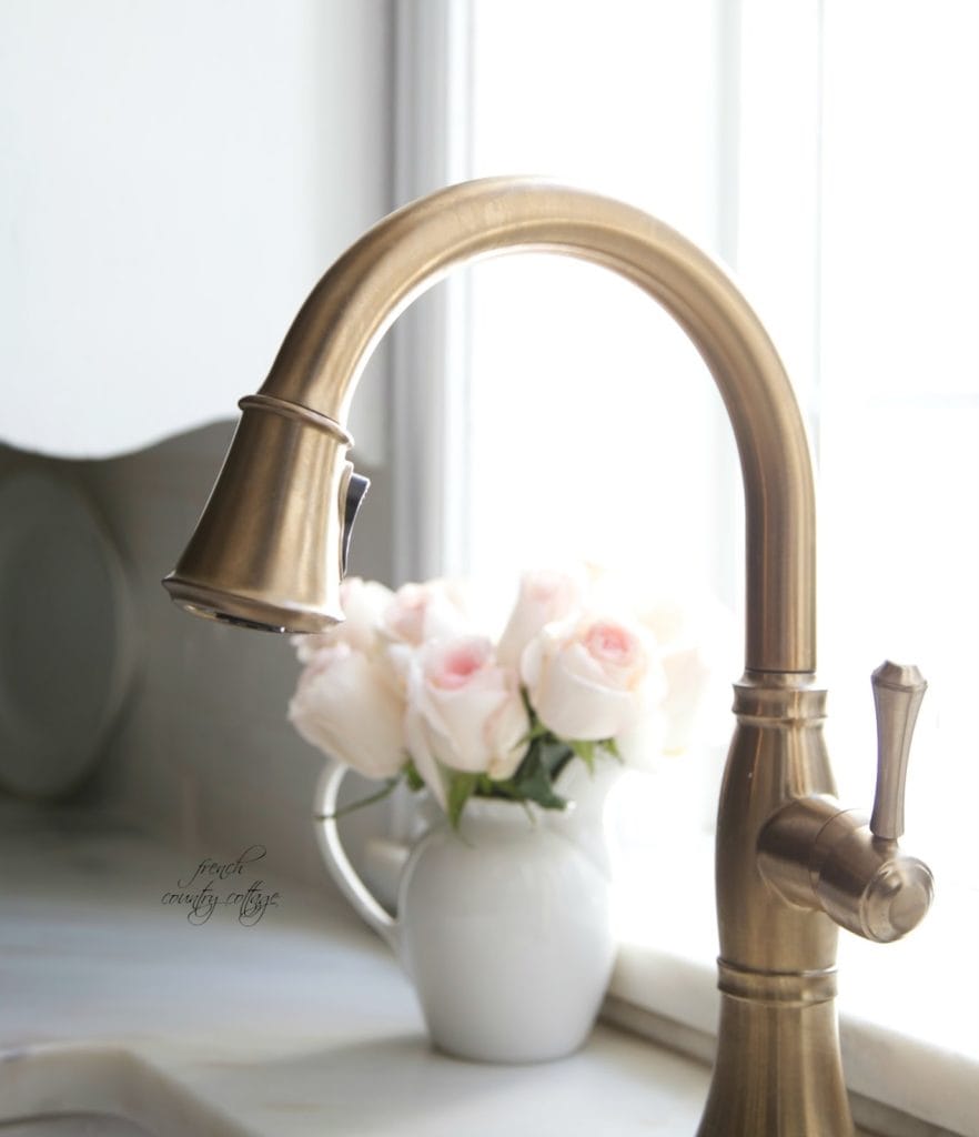 kitchen faucet in champagne bronze with marble