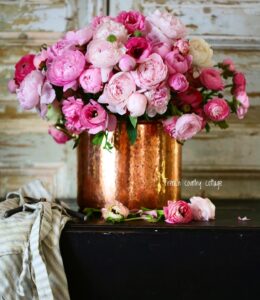 Copper pot with peonies and ranunculus