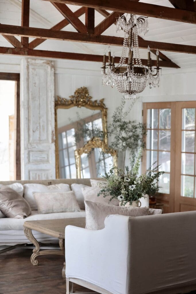 living room with flowers and mirrors 