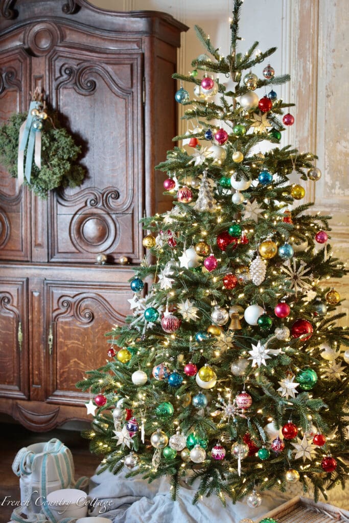 Christmas tree next to armoire 