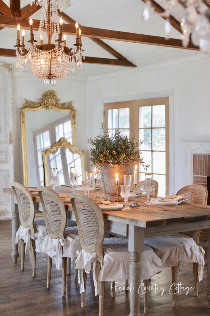 empire chandelier above dining table 