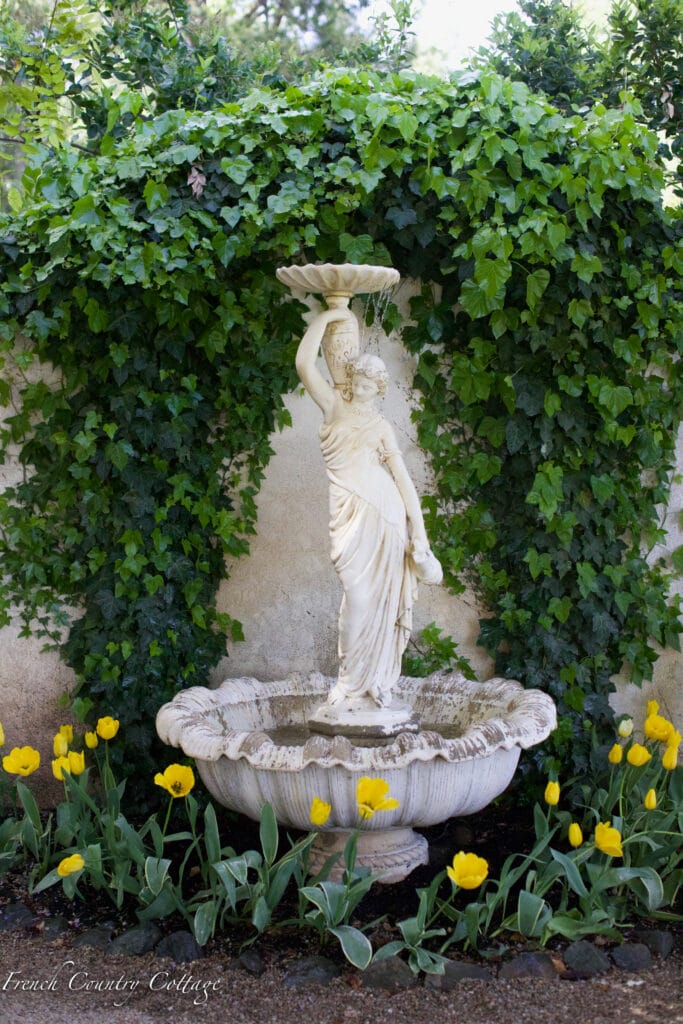 statue in tulip garden