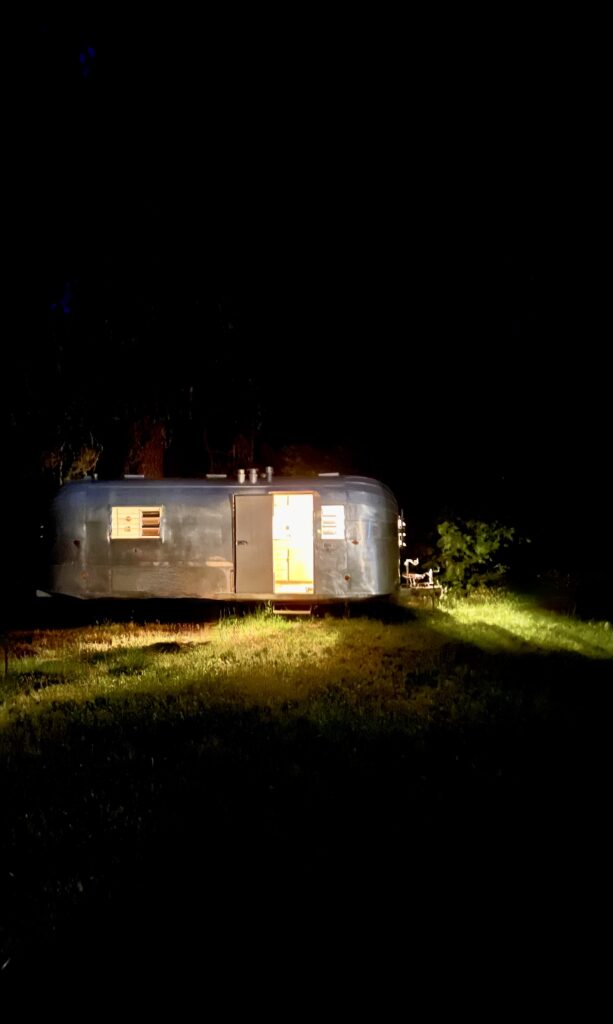 vintage travel trailer at night 