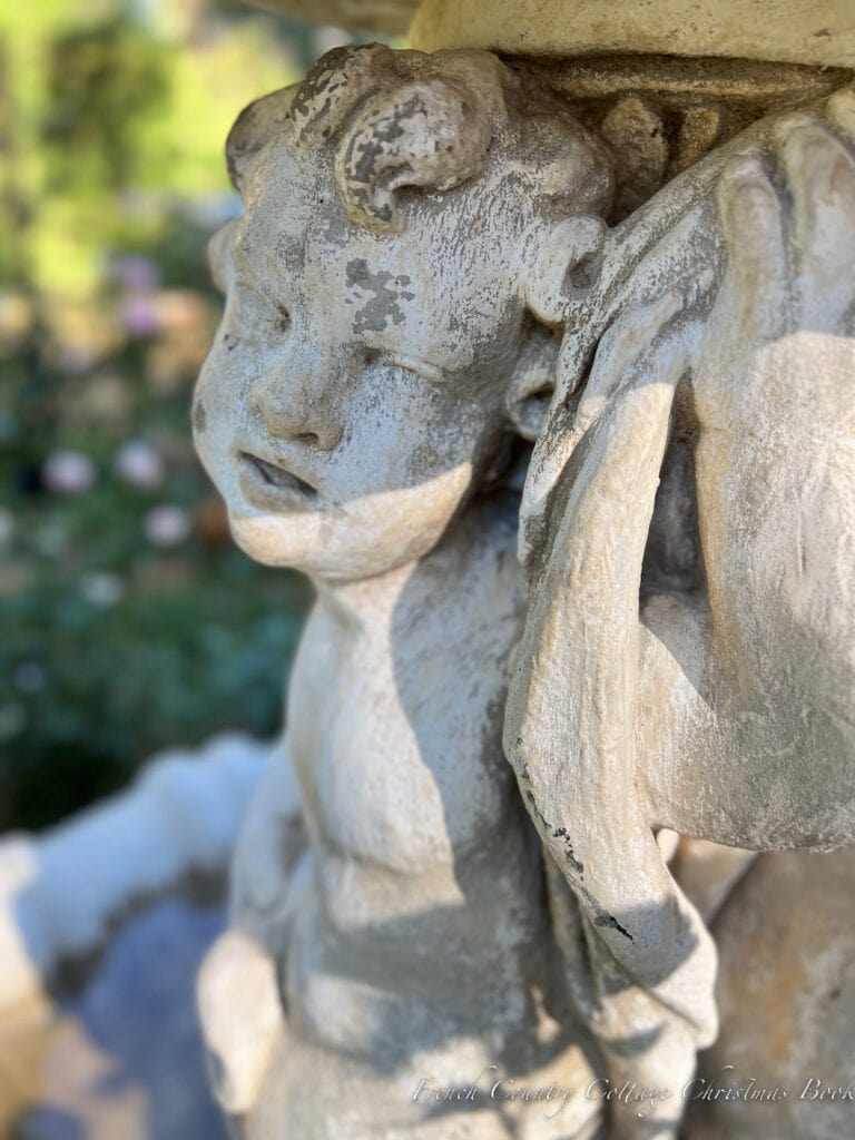 close up antique cherub fountain